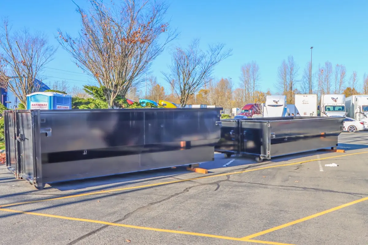 Professional dumpster rental service with roll-off container on residential driveway in Scotts Valley